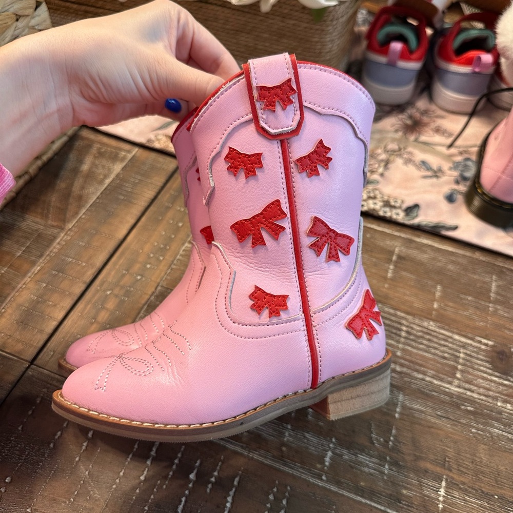 Wild & Rae pink toddler cowgirl boots with red bows!